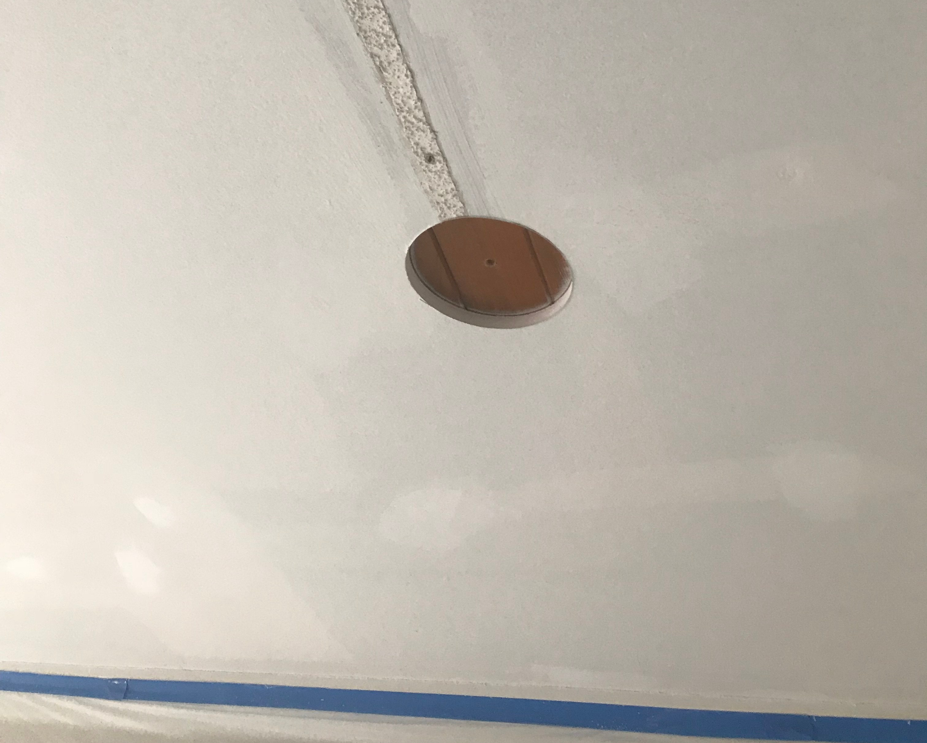 Update Lighting with CAN LED lights 2 Drilling a hole in a sheetrock ceiling for CAN lighting